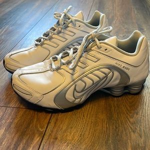 Nike shox sneakers white and silver with minimal wear, mostly from storage.